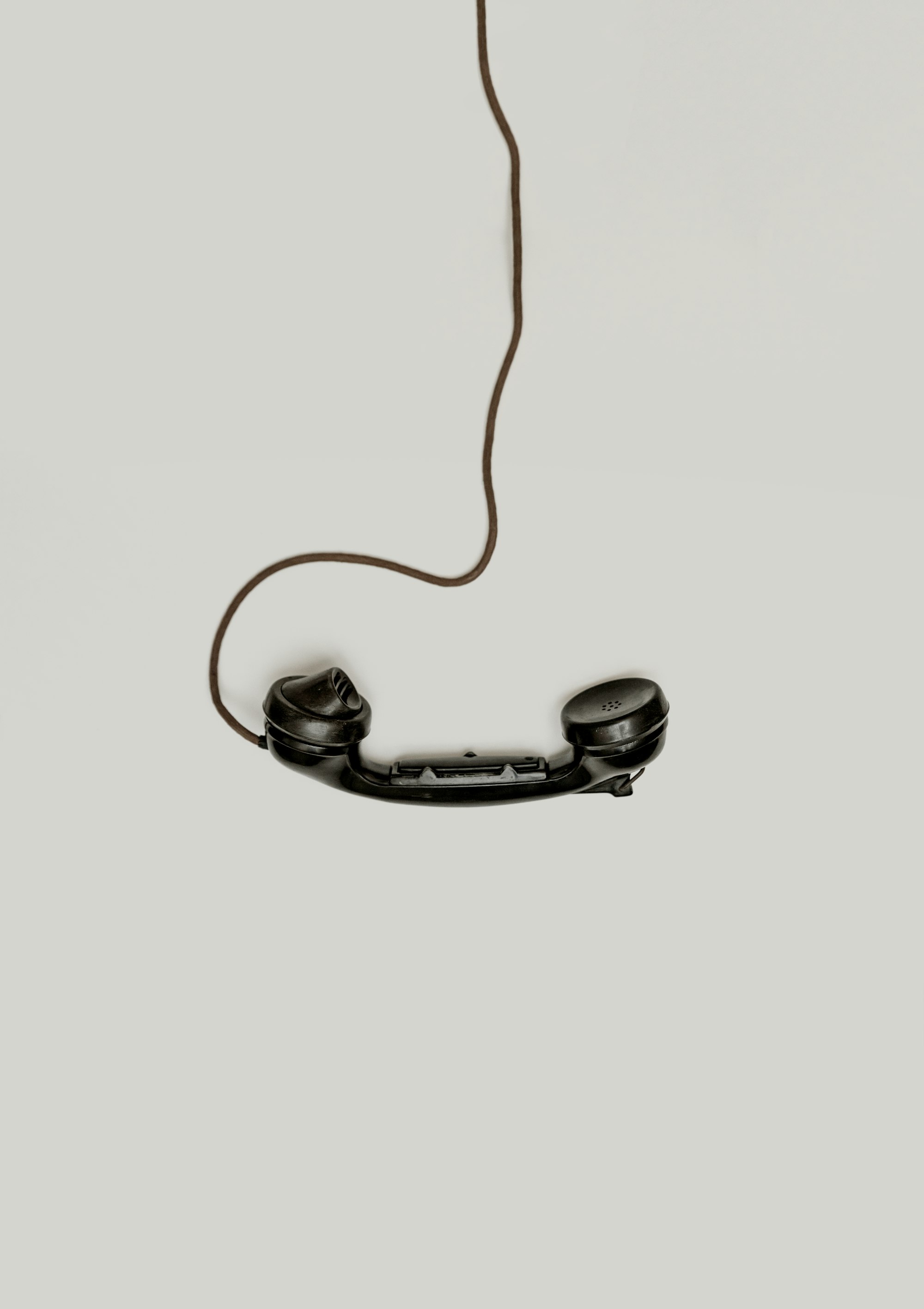 A contractor answering a phone on the job