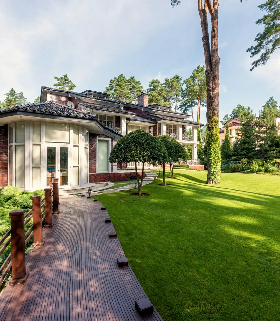 A landscaped property with a stone path and lawn